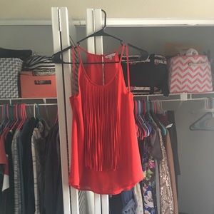 Red tank with tassel detail in front